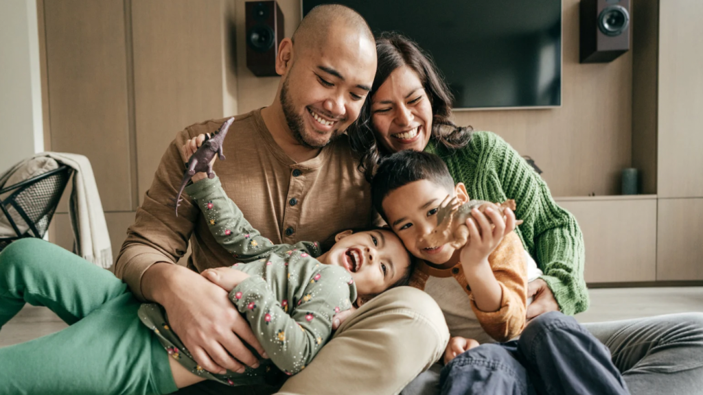 An immigrant family having an open, supportive conversation at home, symbolizing mental health awareness and communication.